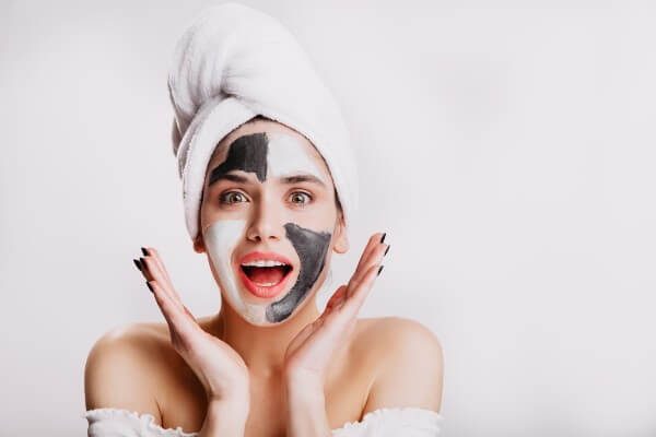 Woman wearing a face mask, illustrating how to test a new skincare product safely