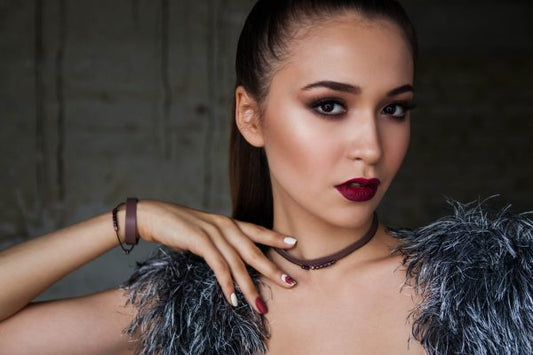 Woman wearing glamorous holiday makeup, illustrating tips for a flawless festive makeup look