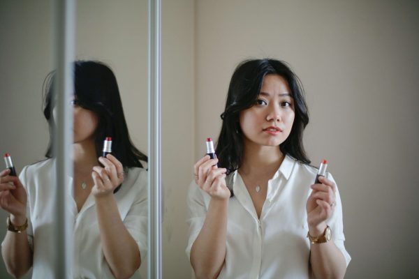 woman-choosing-lipstick